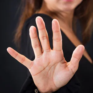 Hand held up to say no