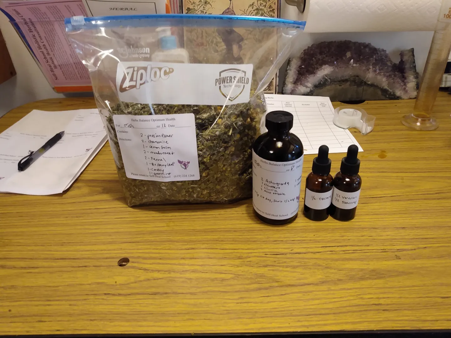 Bag of herbs with tincture bottles and droppers