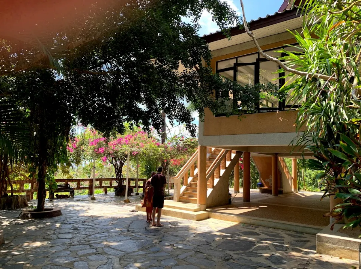 Wooden buildings and gardens at the meditation center