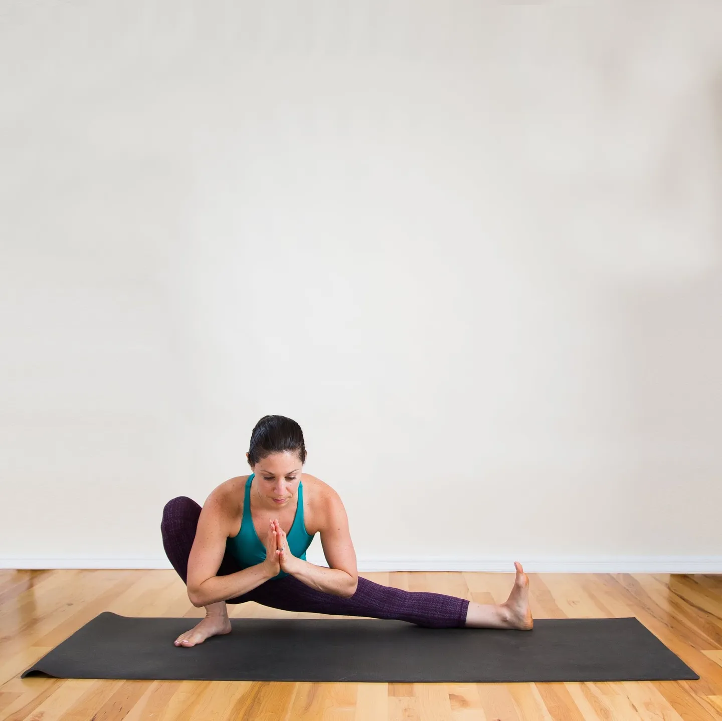 Woman in a side lunge squat