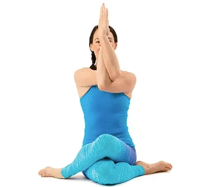 Woman in eagle fold pose