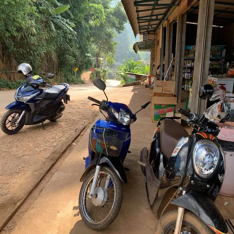 Motorbikes parked on a street in Thailand