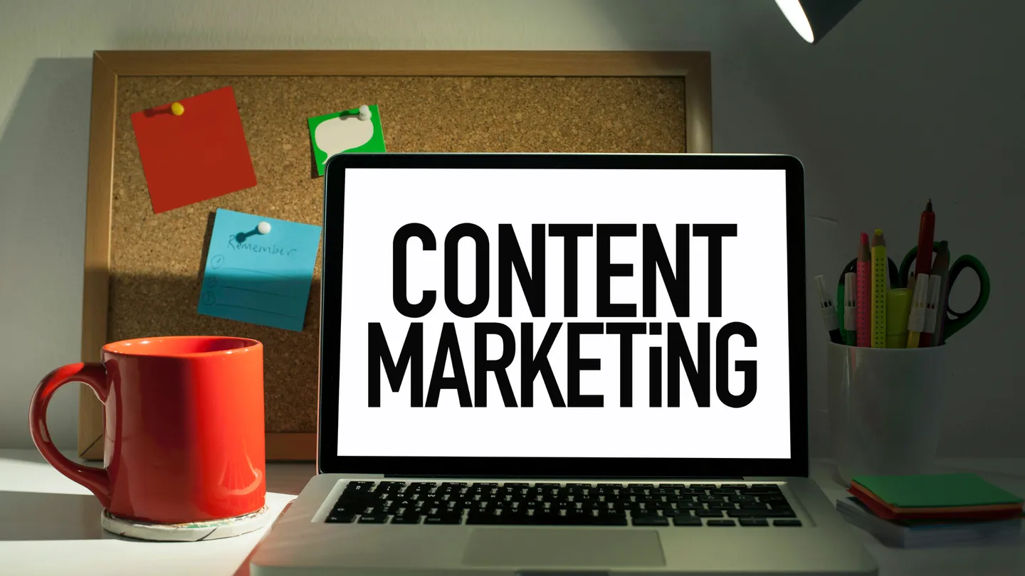 Laptop showing the words “Content Marketing”