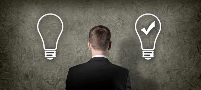 Man between two light bulbs, one with a check mark