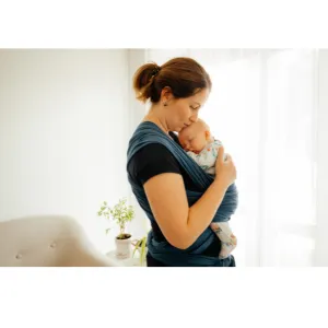 Mother holding her baby close