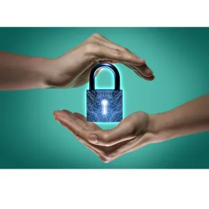 Hands protecting a padlock